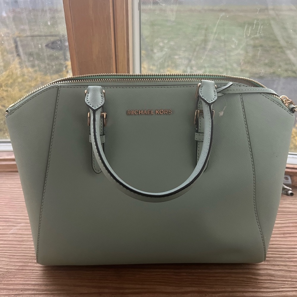 Michael Kors aqua green bag. It is in really good condition.